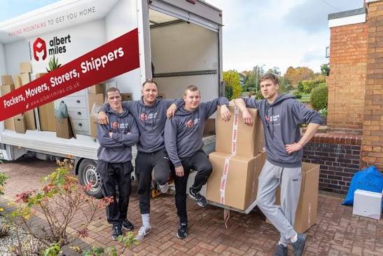 Albert Miles Removals team with moving boxes