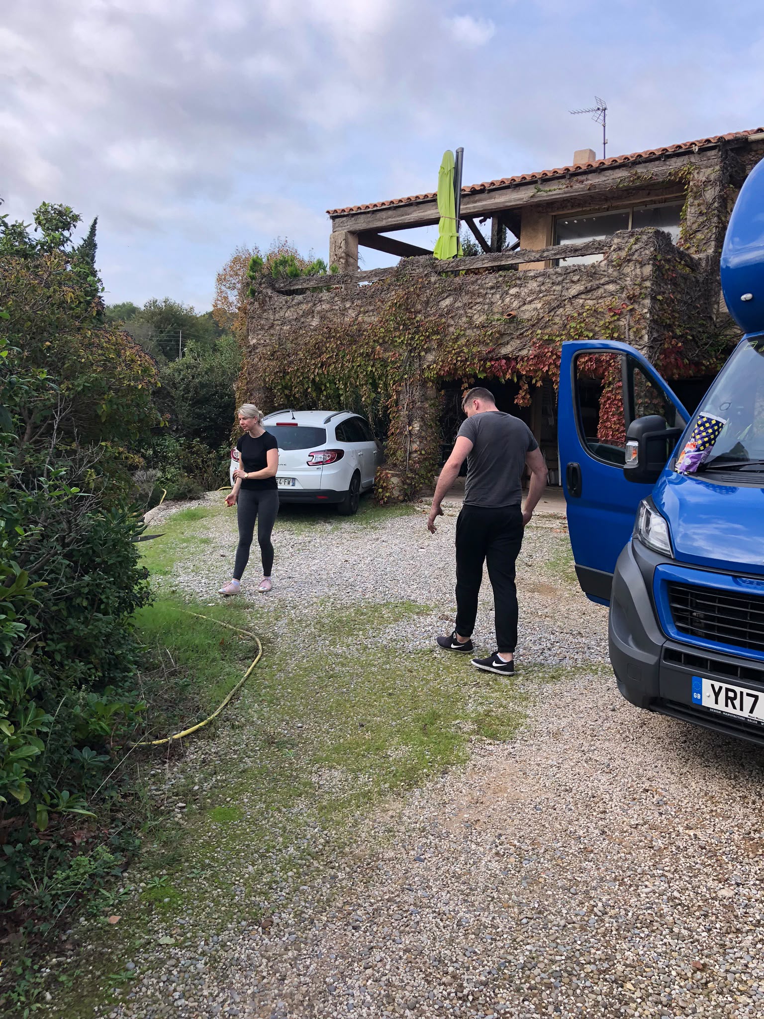 Caring removal team helping an elderly customer move to a new home with patience and professionalism