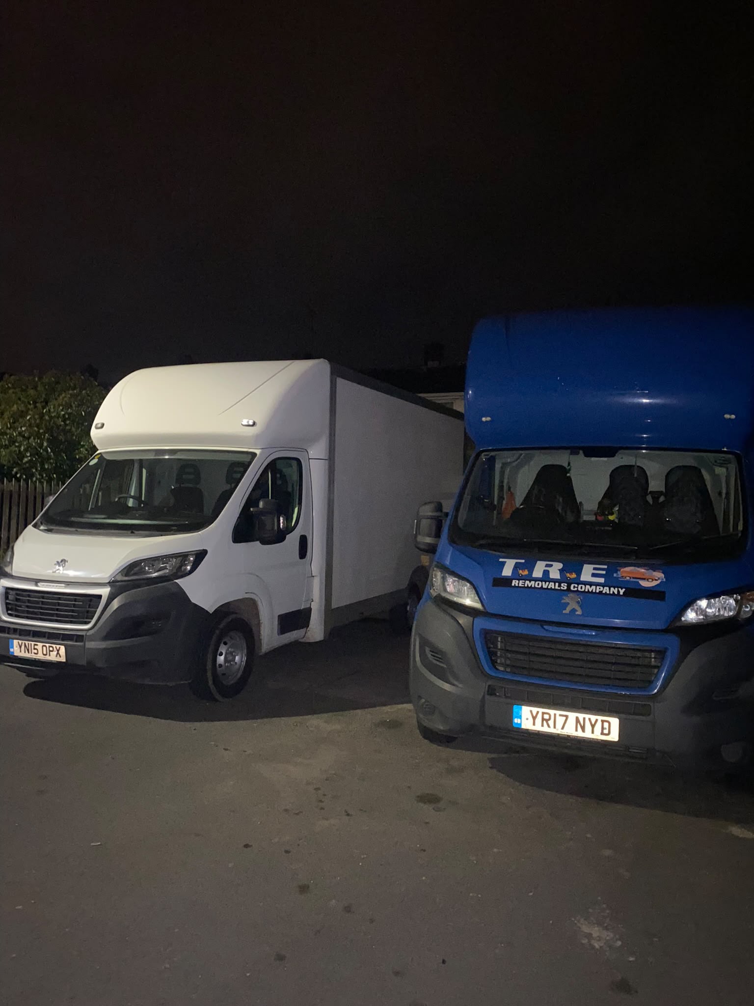 Insurance documents and a pen with a moving truck in the background